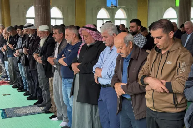 Palestinians attend Friday prayers in a mosque following an attack that local Palestinians said was carried out by Israeli settlers, in the village of Deir Istiya near Salfit in the Israeli-occupied West Bank November 14, 2025. REUTERS/Sinan Abu Mayzer