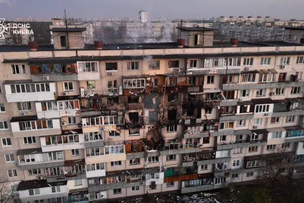 This handout photograph taken and released by the Ukrainian Emergency Service on November 14, 2025, shows a damaged residential building following an air strike in Kyiv, amid the Russian invasion of Ukraine. (Handout / Ukrainian Emergency Service / AFP) 