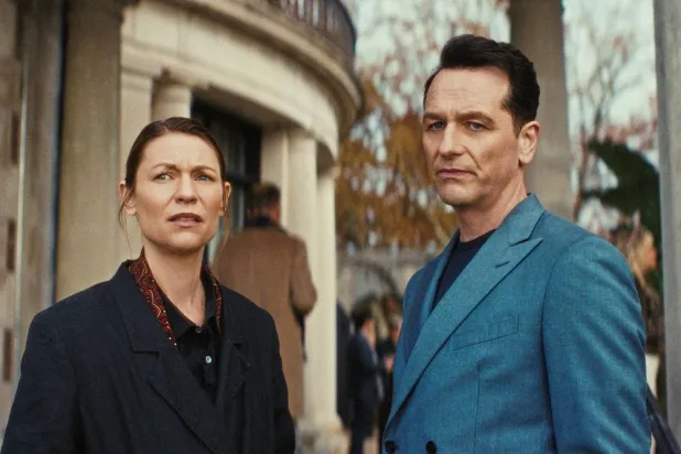 This image released by Netflix shows Claire Danes, left, and Matthew Rhys in a scene from "The Beast in Me." (Netflix via AP) 