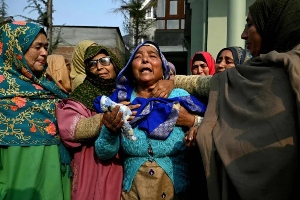 Relatives of the victims who died in an accidental blast at Nowgam police station, mourn in their house on the outskirts of Srinagar, on November 15, 2025. (Photo by TAUSEEF MUSTAFA / AFP)
