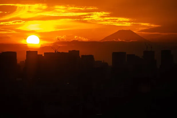 Mount Fuji and city's skyline are pictured from Tower Hall Funabori Observation Deck in Edogawa district of Tokyo on November 12, 2025. (Photo by Philip FONG / AFP)