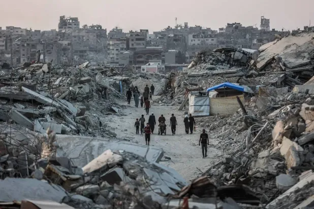 Palestinians amid rubble of destroyed buildings in Jabalia, northern Gaza Strip (AFP)