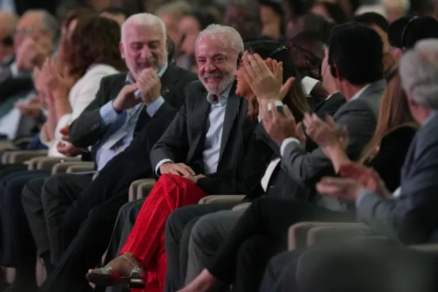 Brazil President Luiz Inacio Lula da Silva, center, reacts during a plenary session at the COP30 UN Climate Summit, Monday, Nov. 10, 2025, in Belem, Brazil. (AP Photo/Fernando Llano)

