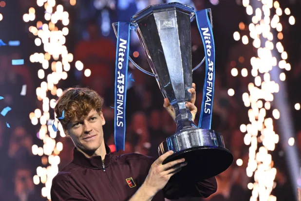 Jannik Sinner of Italy celebrates with the trophy after winning the men's singles final match against Carlos Alcaraz of Spain at the ATP Finals in Turin, Italy, 16 November 2025.  EPA/ALESSANDRO DI MARCO