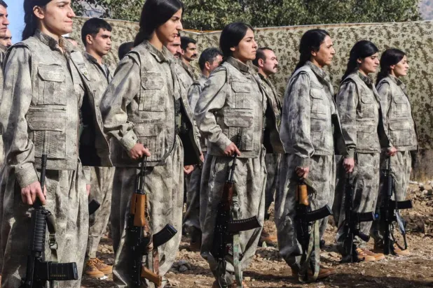 A first group of 25 PKK fighters who had left Türkiye for northern Iraq were at the ceremony, among them eight women. Shwan MOHAMMED / AFP

