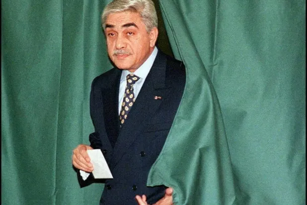 Former Algerian president Liamine Zeroual casting his vote in the 1997 parliamentary elections (AFP). 
