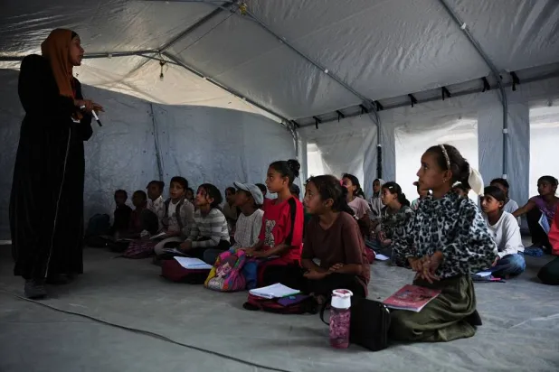 Palestinian students attend class inside a tent set up on the beach in Khan Younis, Gaza Strip, Wednesday, Nov. 12, 2025. (AP)