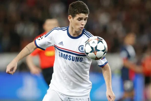 Chelsea’s Oscar eyes the ball during the Champions League quarterfinal first leg soccer match between PSG and Chelsea, at the Parc des Princes stadium, in Paris, Wednesday, April 2, 2014. (AP Photo/Christophe Ena, file)

