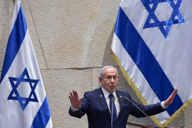 Israel’s Prime Minister Benjamin Netanyahu addresses lawmakers in the Knesset, Israel’s parliament, in Jerusalem, Monday, Nov. 10 2025. (AP Photo/Ohad Zwigenberg)