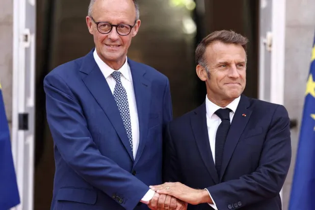 France's President Emmanuel Macron and German Chancellor Friedrich Merz will address a digital summit in Berlin. Manon Cruz / POOL/AFP
