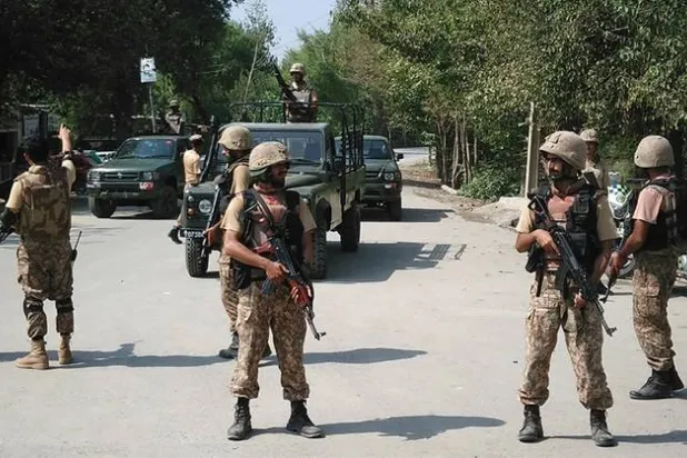 In this file photo, Pakistani soldiers cordon off a street following an attack by suicide bombers on the outskirts of Peshawar on September 2, 2016. (AFP/File)
