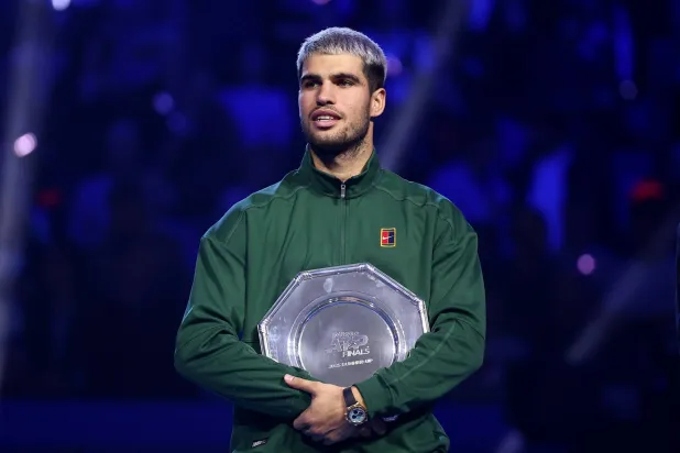 Tennis - ATP Finals - Turin - Palasport Olimpico, Turin, Italy - November 16, 2025 Spain's Carlos Alcaraz with the runners up trophy after losing the final against Italy's Jannik Sinner. (Reuters)