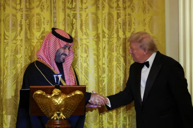 US President Donald Trump greets Prince Mohammed bin Salman, Crown Prince and Prime Minister, during a dinner at the White House in Washington, DC, US, November 18, 2025. (Reuters)  