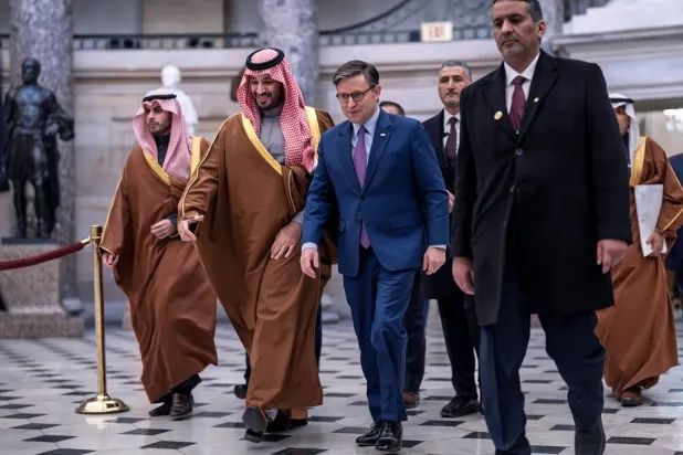 Prince Mohammed bin Salman, Saudi Crown Prince and Prime Minister, left, and Speaker of the House Mike Johnson, R-La., walk through Statuary Hall at the Capitol to a breakfast meeting, in Washington, Wednesday, Nov. 19, 2025. (AP) 