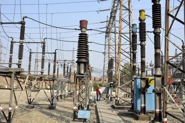 In this photograph taken on November 16, 2016, Pakistani technicians work at a power grid station in Faisalabad. (AFP/FILE)
