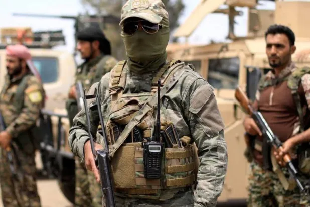  Members of the SDF in Deir Ezzor. (Reuters)