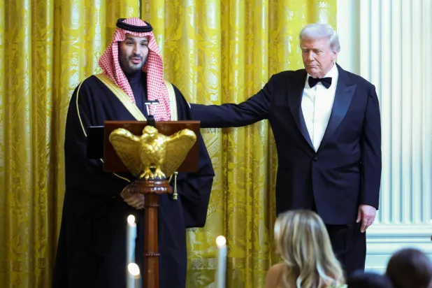 US President Donald Trump greets Saudi Crown Prince and Prime Minister Mohammed bin Salman, during a dinner at the White House in Washington, D.C., US, November 18, 2025. REUTERS/Tom Brenner