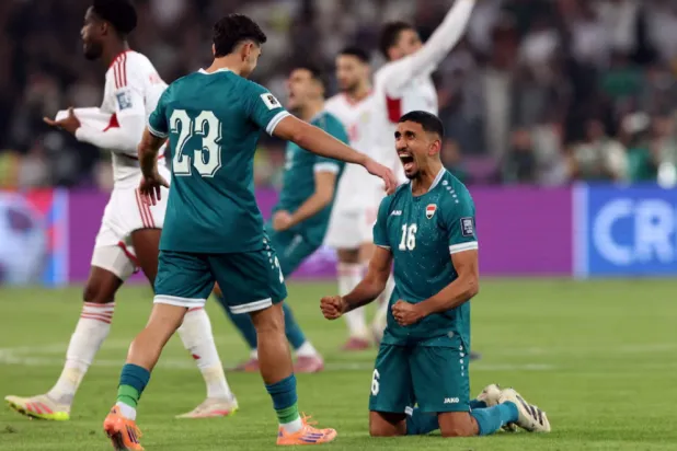 FIFA World Cup - AFC Qualifiers - Play Off - Second Leg - Iraq v United Arab Emirates - Basra International Stadium, Basra, Iraq - November 18, 2025 Iraq's Amir Al-Ammari and Merchas Doski celebrate after the match REUTERS/Thaier Al-Sudani 