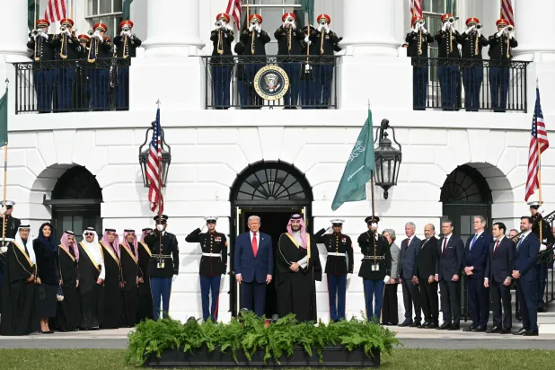 US President Donald Trump greets Crown Prince and Prime Minister of the Kingdom of Saudi Arabia Mohammed bin Salman on the South Lawn at the White House in Washington, DC on November 18, 2025. (Photo by SAUL LOEB / AFP)