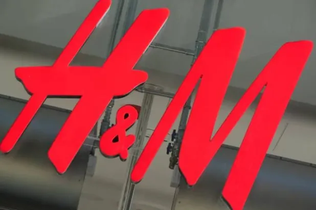 The logo for H&M is displayed outside a store in Stockholm, Sweden, September 23, 2025. REUTERS/Tom Little