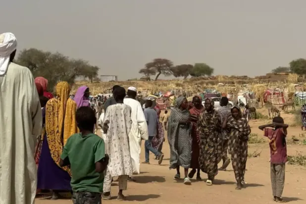 People who fled the Zamzam camp for the internally displaced walk in a makeshift encampment in an open field near the town of Tawila in war-torn Sudan's western Darfur region on April 13, 2025. © AFP