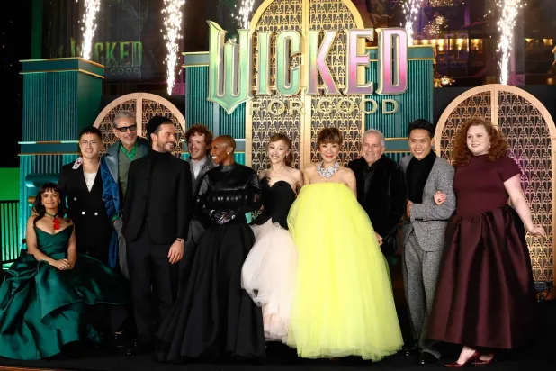  British actress Cynthia Erivo (6th-L), US singer-songwriter Ariana Grande (5th-R) and other cast members attend the premiere of "Wicked: For Good" at Lincoln Center for the Performing Arts in New York on November 17, 2025. (AFP) 
