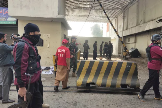 Pakistani security officials inspect the scene of a militant attack at the paramilitary FC headquarters in Peshawar, the provincial capital of KPK, Pakistan, 24 November 2025. EPA/BILAWAL ARBAB

