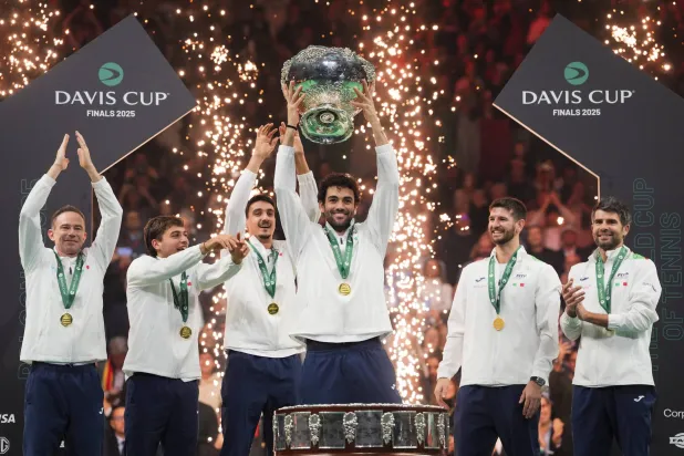 23 November 2025, Italy, Bologna: Italian tennis player Matteo Berrettini and captain Filippo Volandri celebrate with teammates after winning the 2025 Davis Cup final match between Italy and Spain at Bologna Fiere. Photo: Massimo Paolone/LaPresse via ZUMA Press/dpa