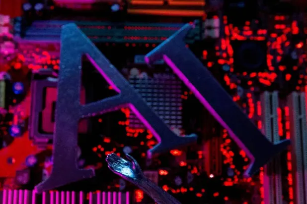 AI (artificial intelligence) letters and a robot hand are placed on computer motherboard in this illustration created on June 23, 2023. (Reuters)