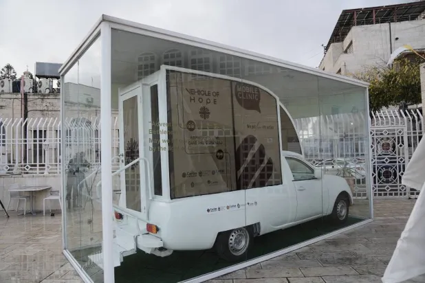 The one-time popemobile used by Pope Francis during a 2014 visit to Bethlehem and was repurposed into a mobile health clinic for children in the Gaza Strip, an initiative approved by the Pope before his death, is displayed in the West Bank city of Bethlehem, Tuesday, Nov. 25, 2025. (AP) 