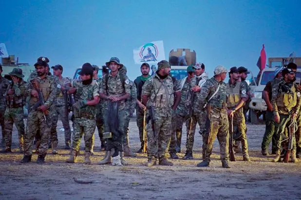 عناصر من «الحشد الشعبي» خلال دورية استطلاع في موقع شمال بغداد (إعلام الهيئة)