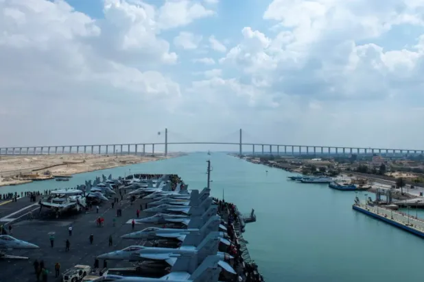 United States Navy aircraft carrier USS Dwight D. Eisenhower (CVN 69) approaches the Friendship Bridge during a Suez Canal transit in this picture taken April 2, 2021 and released by US Navy on April 3, 2021. (Reuters)