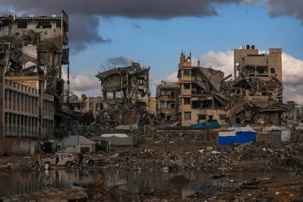  The tents of Palestinian families surrounded by destroyed buildings during a rainy day in Gaza City, Gaza Strip, 25 November 2025. (EPA)