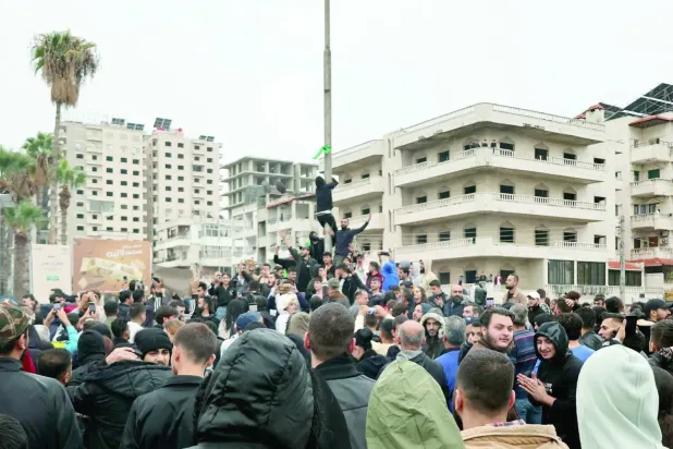 Batı Suriye'nin Lazkiye kentindeki bir gösteriden (AFP)