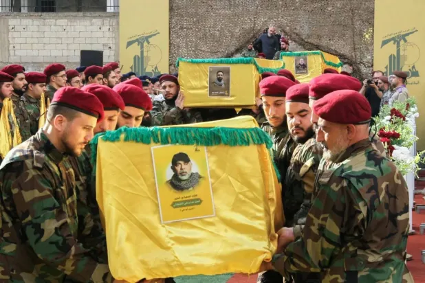Hezbollah members carry the coffin of Chief of Staff Haitham Tabtabai during his funeral on Monday in Beirut’s southern suburbs (AFP)