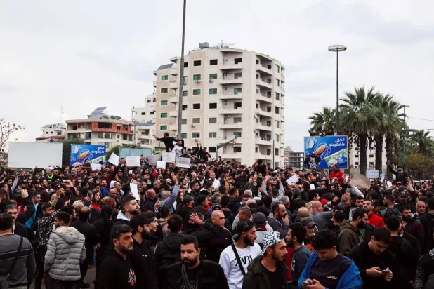 Alawites gather during a protest to demand federalism and the release of detained members of their community, in Latakia, Syria November 25, 2025. (Reuters)