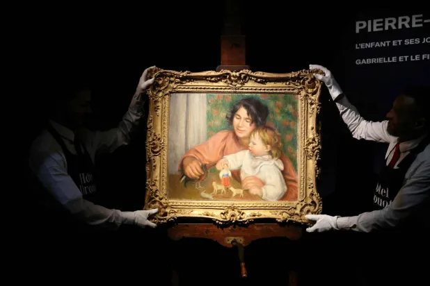 This photograph shows an exclusive presentation of an oil painting on canvas (before 1910), entitled "L'enfant et ses jouets – Gabrielle et le fils de l'artiste, Jean" ("The Child and His Toys - Gabrielle and the son's artist, Jean"), a major piece of art by French painter Pierre-Auguste Renoir (1841-1919) at Drouot auction house in Paris, on October 16, 2025. (AFP)
