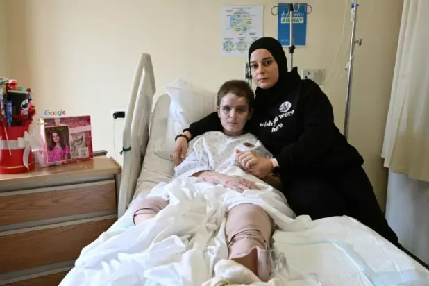 Amani Bazzi and her daughter Aseel survived an Israeli strike in south Lebanon that killed four members of their family © Joseph EID / AFP
