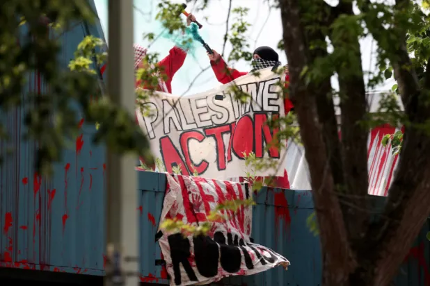 Protesters from "Palestine Action" demonstrate on the roof of Guardtech Group in Brandon, Suffolk, Britain, July 1, 2025. REUTERS/Chris Radburn 