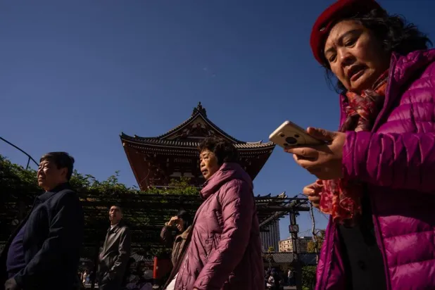 Mainland Chinese tourists are seen in the Asakusa district of Tokyo, Thursday, Nov. 20, 2025. (AP)