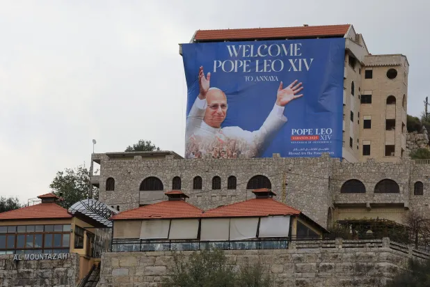  A banner depicting Pope Leo XIV hangs from a building ahead of his planned visit to Lebanon, in Annaya, Lebanon November 25, 2025. (Reuters)