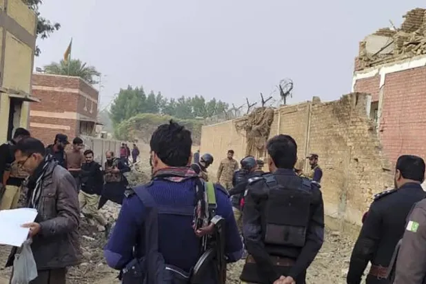 File photo: Security officials examine damage at the site of a bombing on the outskirts of Dera Ismail Khan, Pakistan on Tuesday, December 12, 2023. AP
