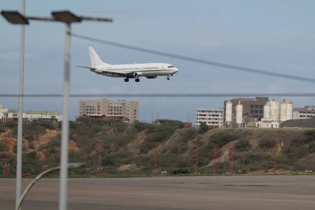 A plane lands at Simon Bolivar International Airport in Maiquetia, near Caracas, Venezuela, 26 November 2025. EPA/RONALD PENA R.