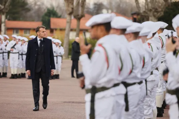 France's President Emmanuel Macron reviews the troops prior to unveiling a new national military service in a speech at an army base in the French on November 27, 2025. Pool via Reuters
