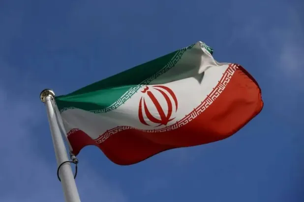 The Iranian flag waves in front of the International Atomic Energy Agency (IAEA) headquarters, before the beginning of a board of governors meeting, amid the coronavirus disease (COVID-19) outbreak in Vienna, Austria, March 1, 2021. (Reuters)
