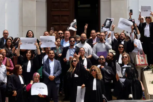 Lawyers carry banners during a protest against the arrest of Sonia Dahmani, a prominent lawyer critical of the president, outside the Palace of Justice building in Tunis, Tunisia May 13, 2024. REUTERS/Jihed Abidellaoui 