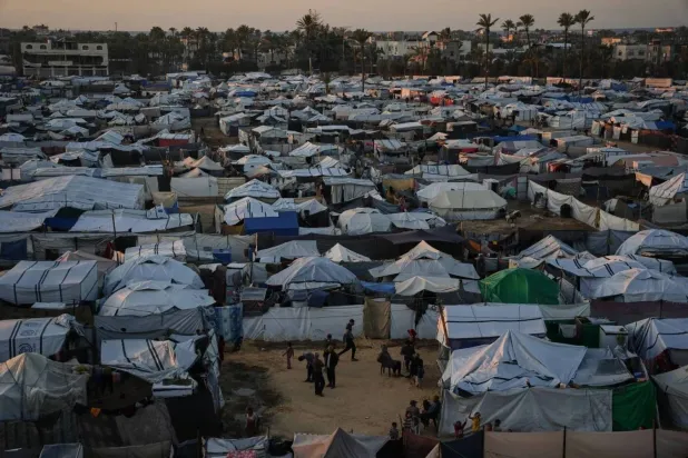 Temporary tents shelter displaced Palestinians in Deir al Balah in central Gaza (AP)