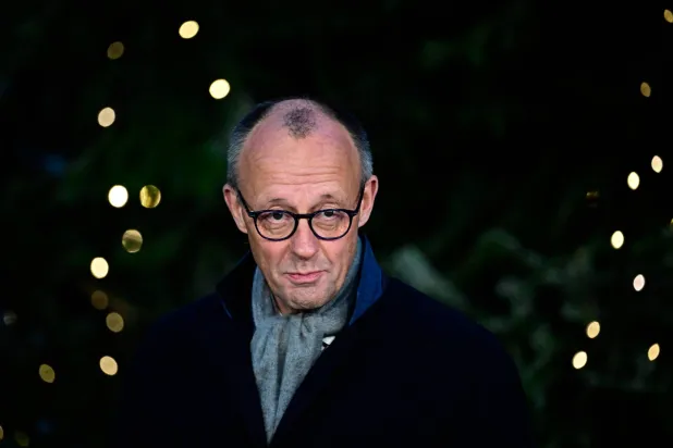  German Chancellor Friedrich Merz attends an official event to hand over the Christmas tree for the Chancellery, on November 28, 2025 in front of the Chancellery in Berlin. (AFP) 