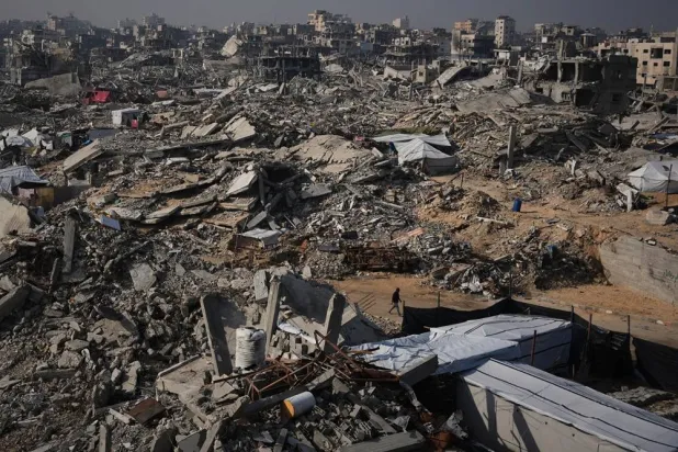  A man walks through the destruction caused by the Israeli air and ground offensive in Sheikh Radwan neighborhood in Gaza City, Friday, Nov. 28, 2025. (AP) 