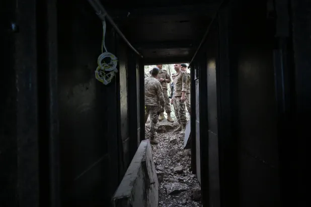 Members of the army are seen at the entrance of a tunnel in Zibqin. (Asharq Al-Awsat) 
